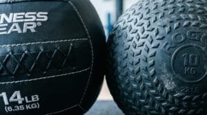generate an image for the topic of Soft Medicine Ball vs. Hard Slam Ball Training Applications